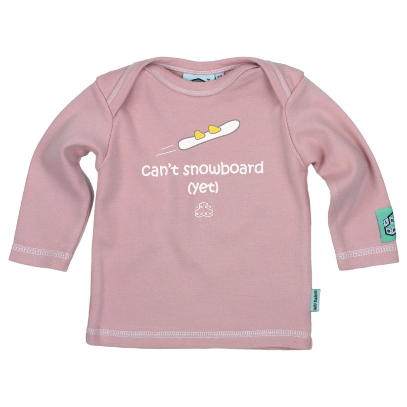 Pink long sleeve t shirt with can't snowboard yet slogan and image of small feet on snowboard
