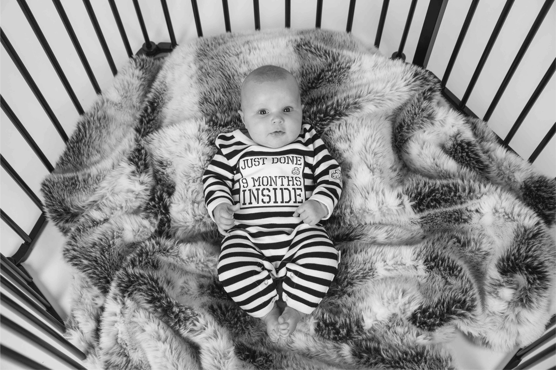 Baby wearing Just Done 9 Months Inside funny baby grow 