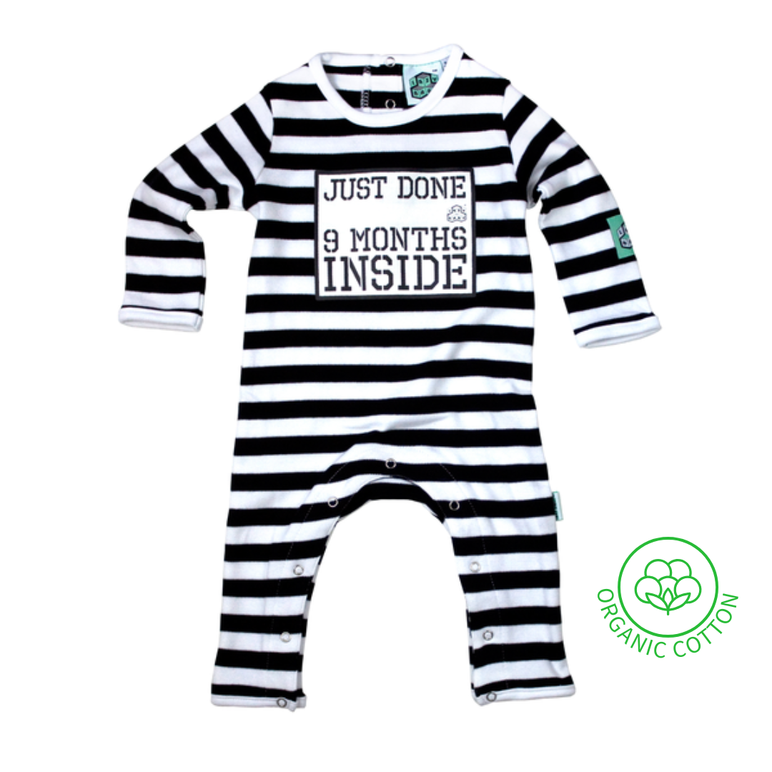 Black and white striped baby romper with slogan Just Done 9 Months Inside and organic cotton logo