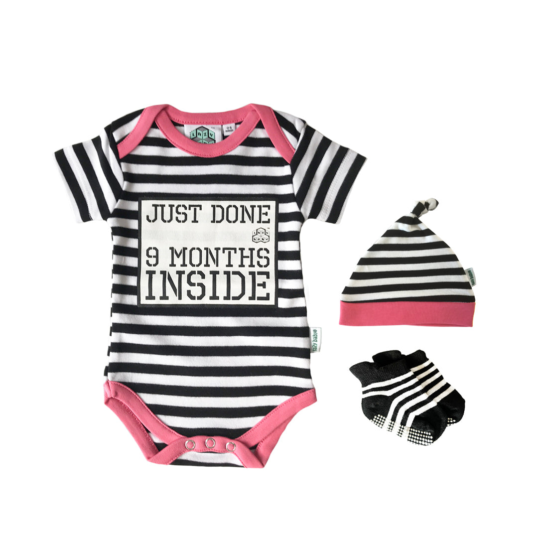 Just Done 9 Months Inside slogan vest in black and white stripes with pink edging trim, with matching stripy hat and socks