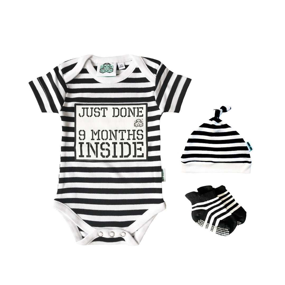Just Done 9 Months Inside slogan vest in black and white stripes with matching stripy hat and socks